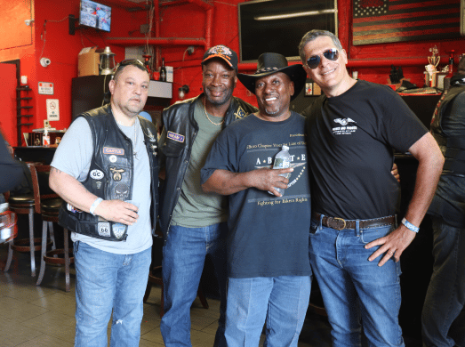 mitchell with three other motorcyclist at a motorcycle event