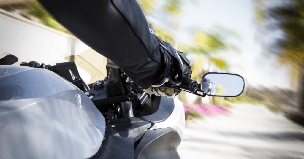 Motorcycle rider and blurry road ahead