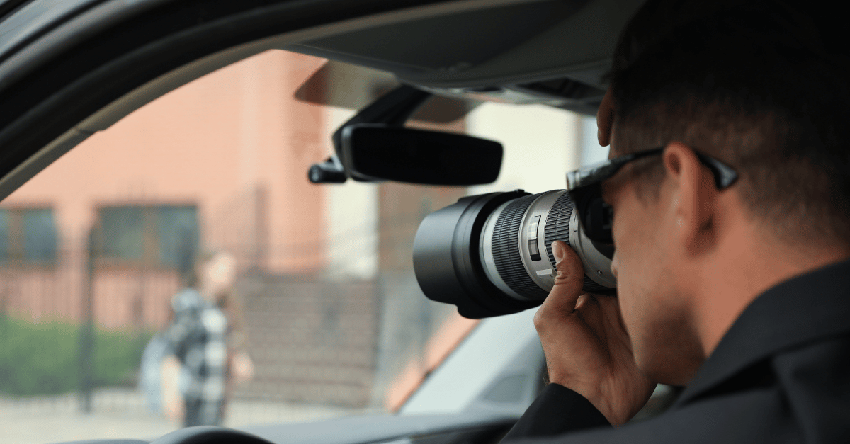 man with camera spying on woman