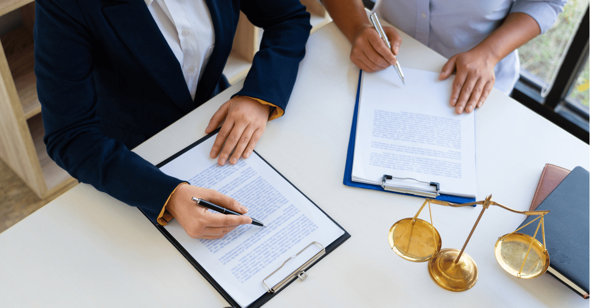Personal Injury Lawyer signing papers