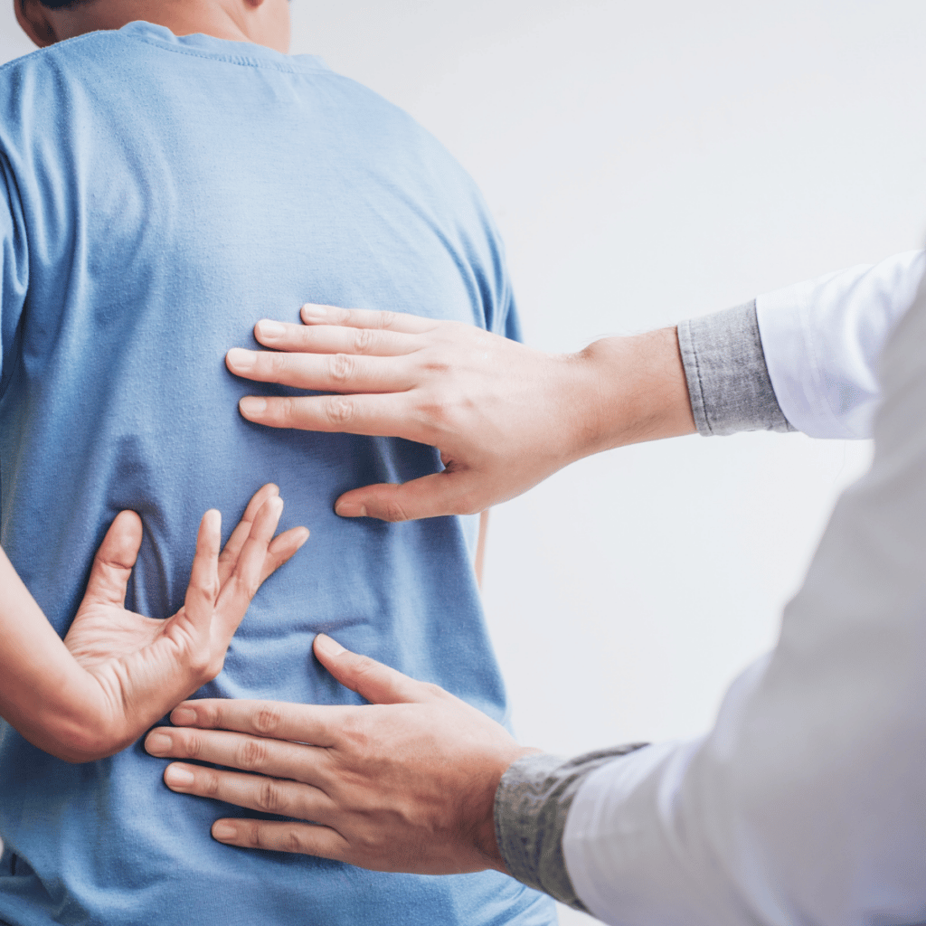 doctor examining a patients back injury